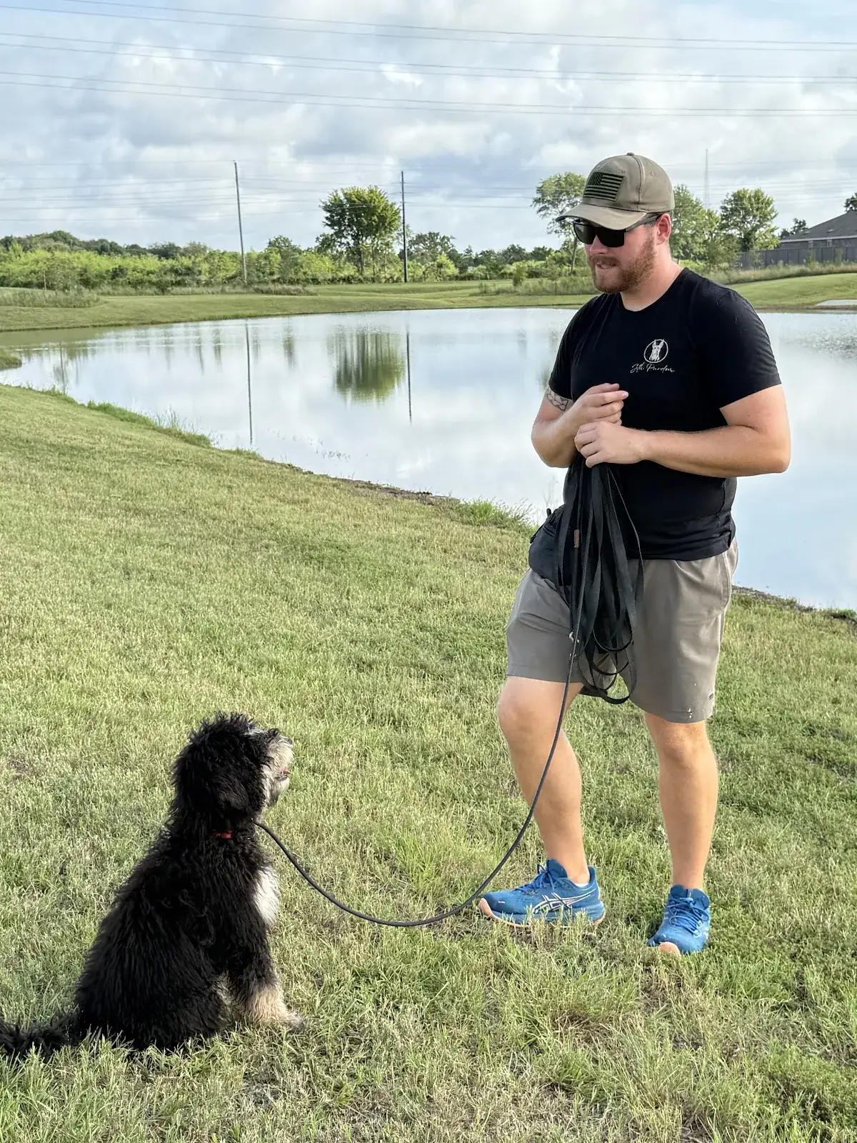 Seth working a dog at the edge of the lake